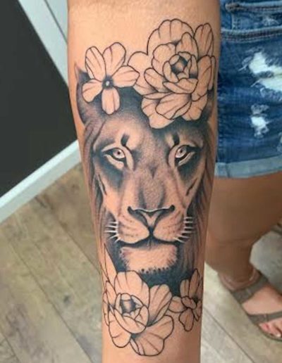 Lion and Flowers Tattoo